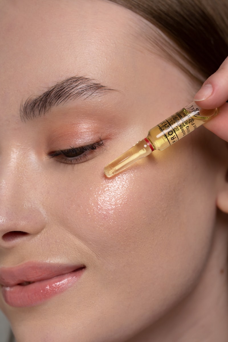 Niacinamide vs Vitamin C — Can You Use Both? (The Real Answer) vitamin C serum being applied